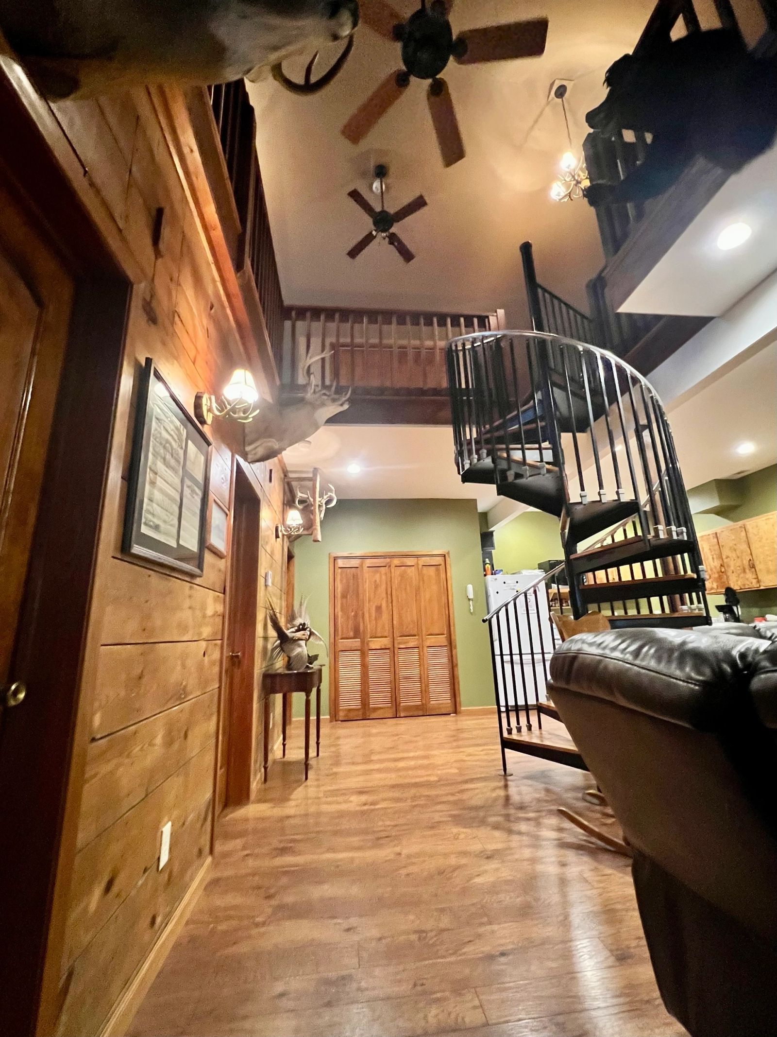 Lodge entry with spiral staircase at Coteau View Hunts lodging in Conde, SD