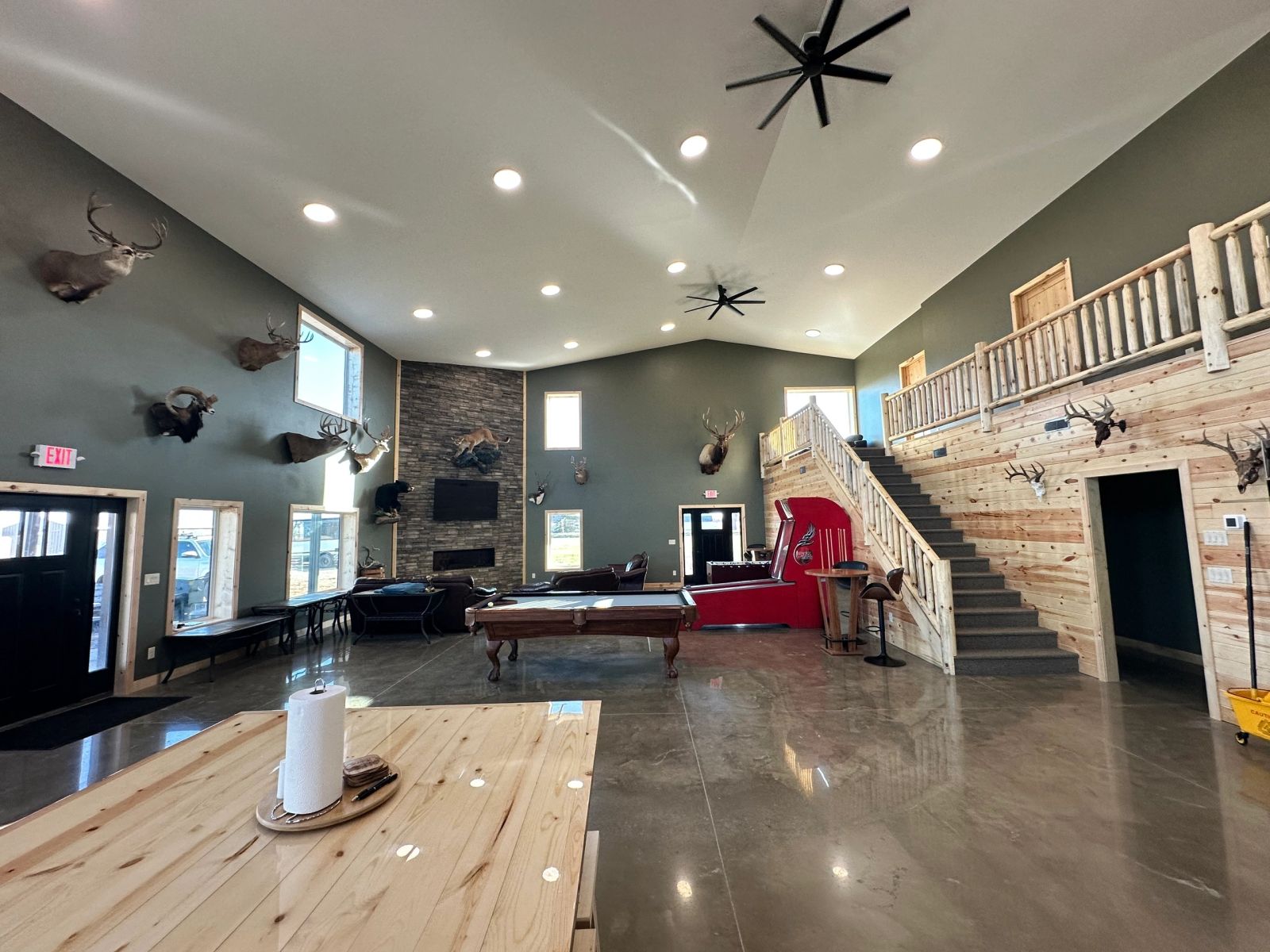Vaulted great room and loft railing at the Conde, SD hunting lodge