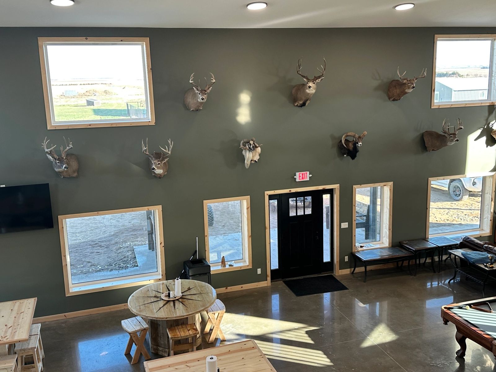 Dining area with whitetail mounts at the Conde, SD pheasant hunting lodge