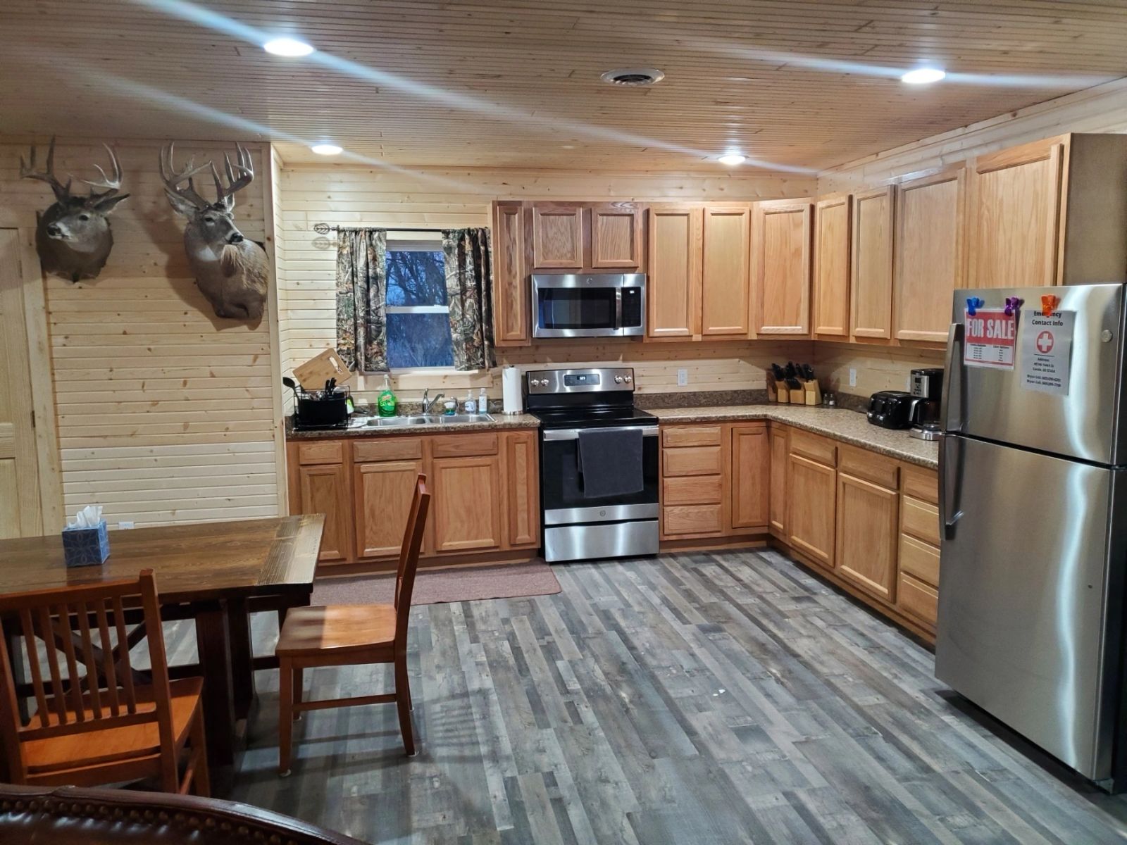 Guest cabin kitchen with whitetail mounts at the South Dakota pheasant hunting lodge in Conde, SD
